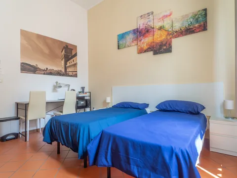 Bedroom with blue beds and desk