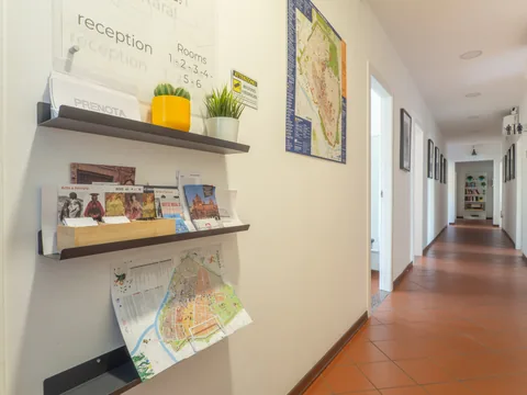 Hallway with shelves and guest information