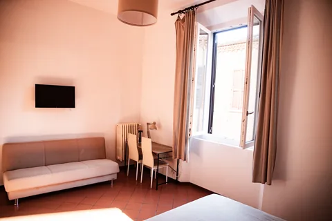 Living area with sofa, table and window
